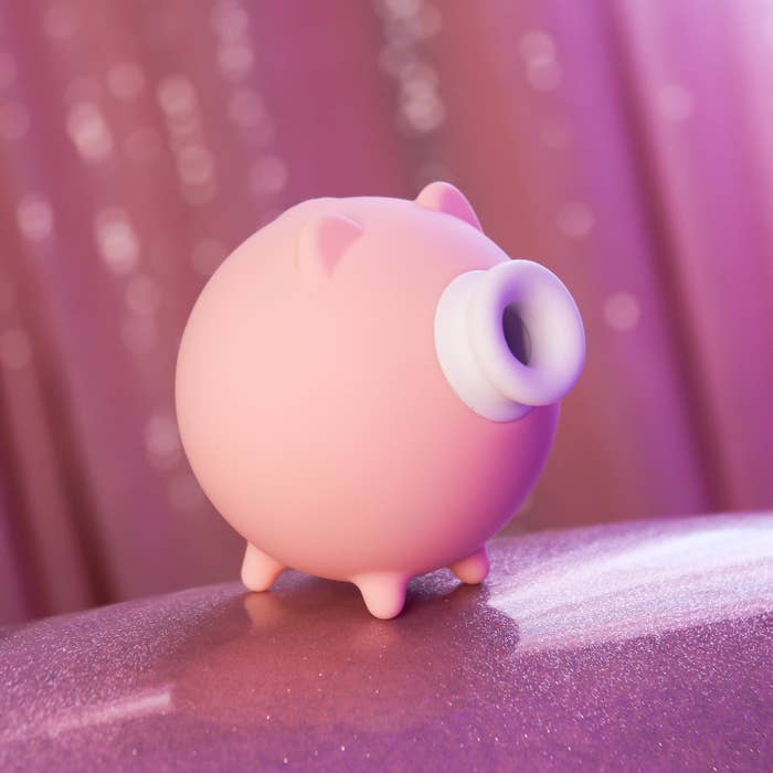 Pink pig-shaped suction vibrator