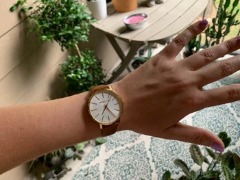 Reviewer photo of the watch with brown leather straps