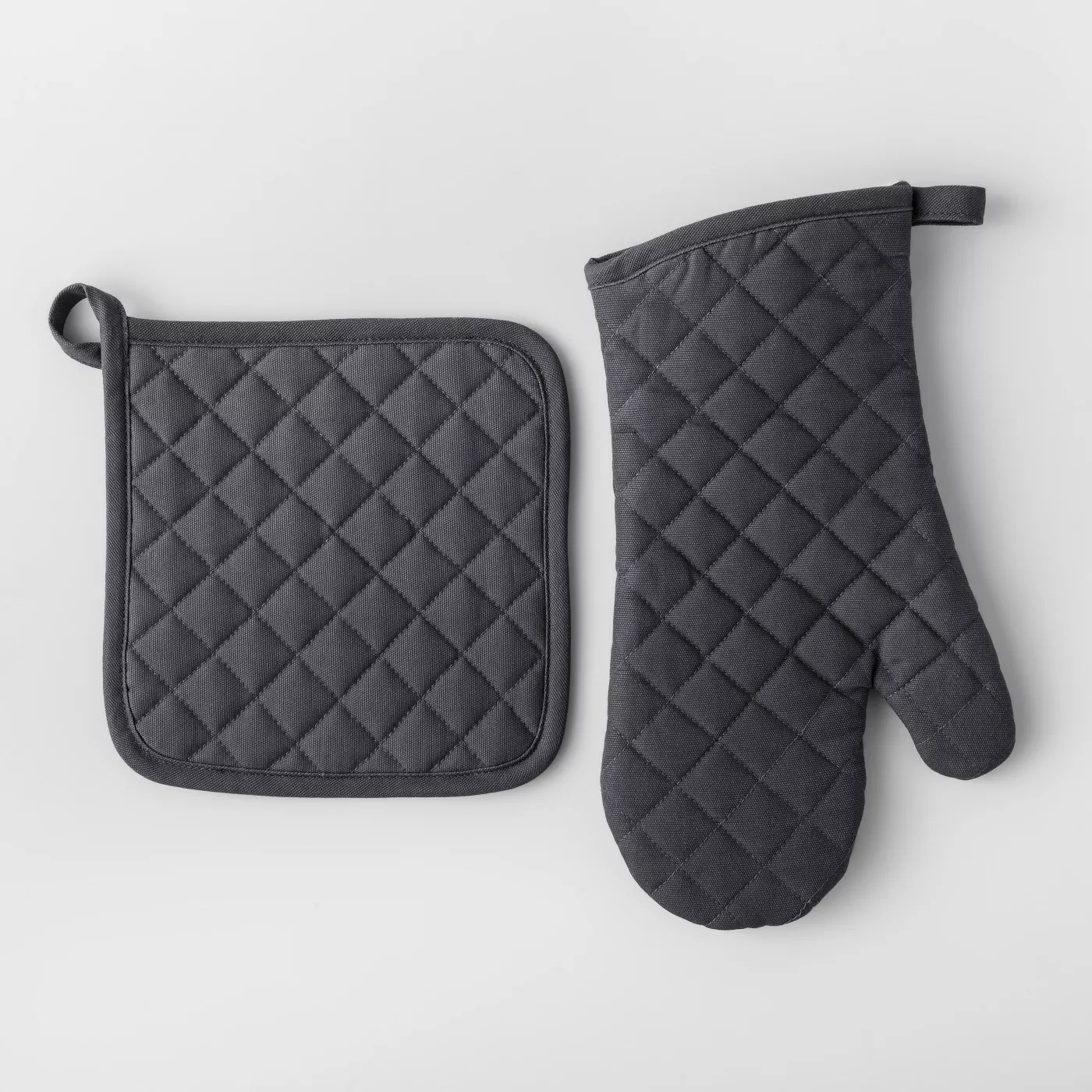 The quilted pot holder and oven mitt