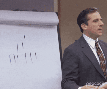 Jim drawing a pyramid around Michael scott&#x27;s drawing in the office