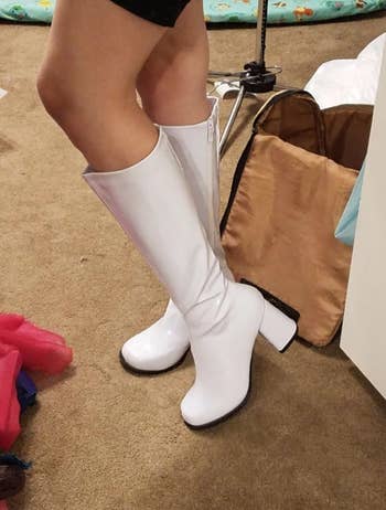 a reviewer wearing the boots in white 