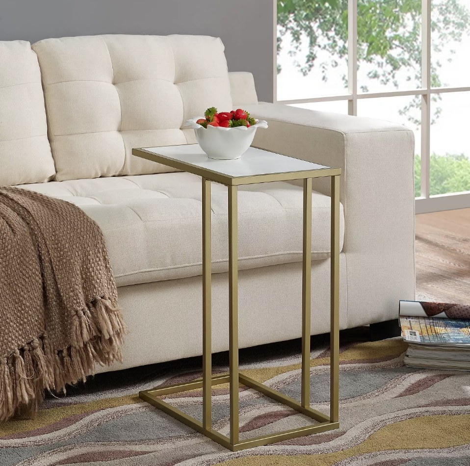 Gold slide end table with white surface