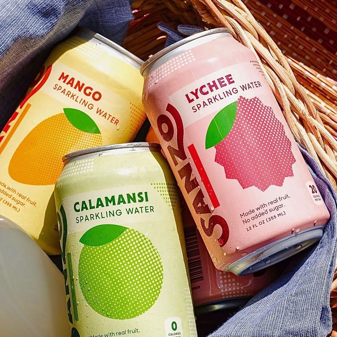 The cans of sparkling water in all three flavors