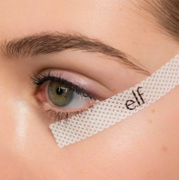 the strip of tape on the side of the eye where the eyeshadow should stop