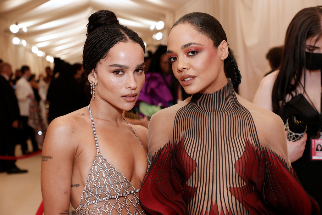 A close up of Tessa Thompson and Zoë Kravitz as they pose on the Met Gala carpet