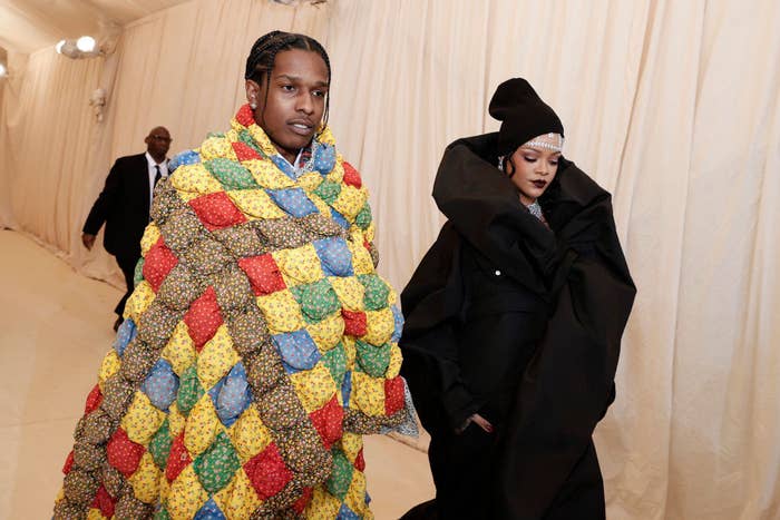 ASAP Rocky and Rihanna walk through a tunnel to arrive at the Met Gala