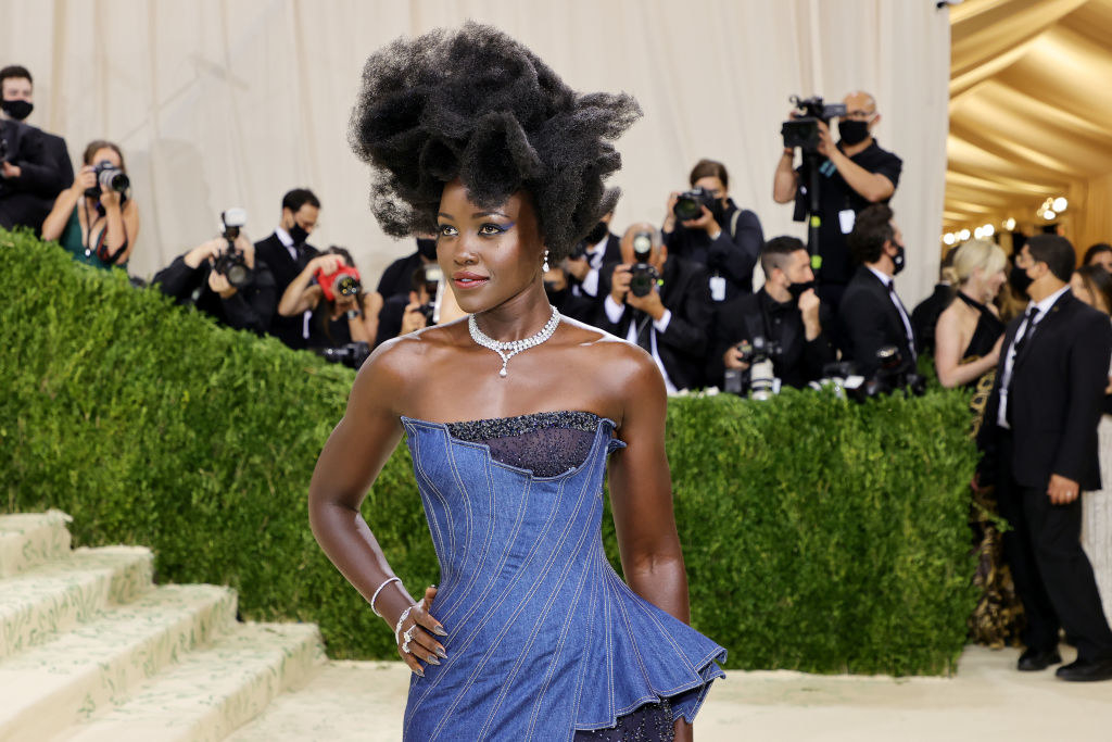 A close up of Lupita Nyong&#x27;o as she poses on the Met steps