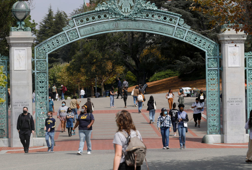 Students walking through the gateway to UC Berkeley&#x27;s campus