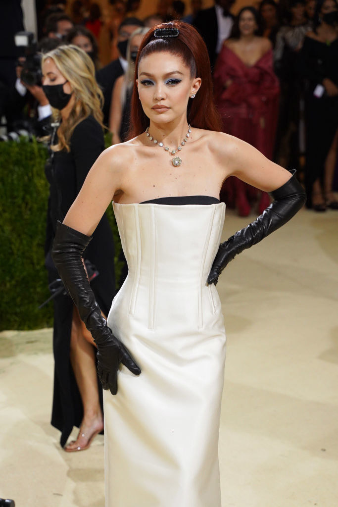 Gigi wore a strapless gown with a structured bodice and gloves