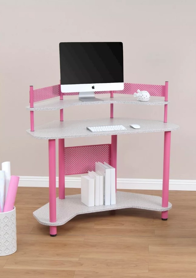 Pink and gray three layered desk with desk top on main shelf