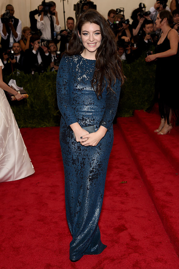Lorde wore a simple form-fitting gown with 3/4 length sleeves