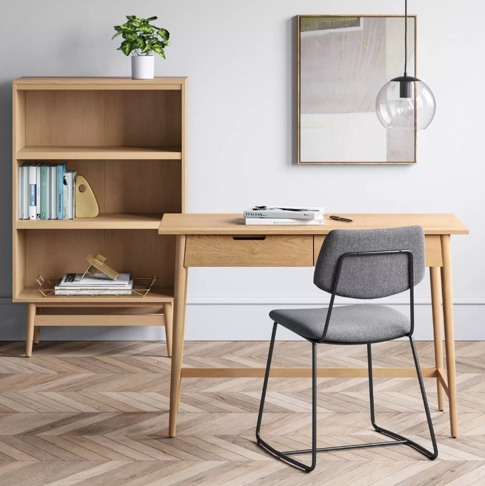 Light wooden desk with two front drawers, gray computer chair
