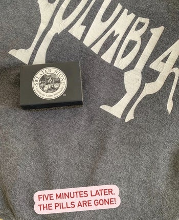 the stone on top of the smooth-looking sweatshirt, with the text 