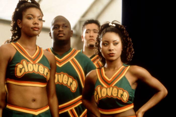 Gabrielle&#x27;s character wears her green cheerleader uniform in the movie while standing next to her squad members
