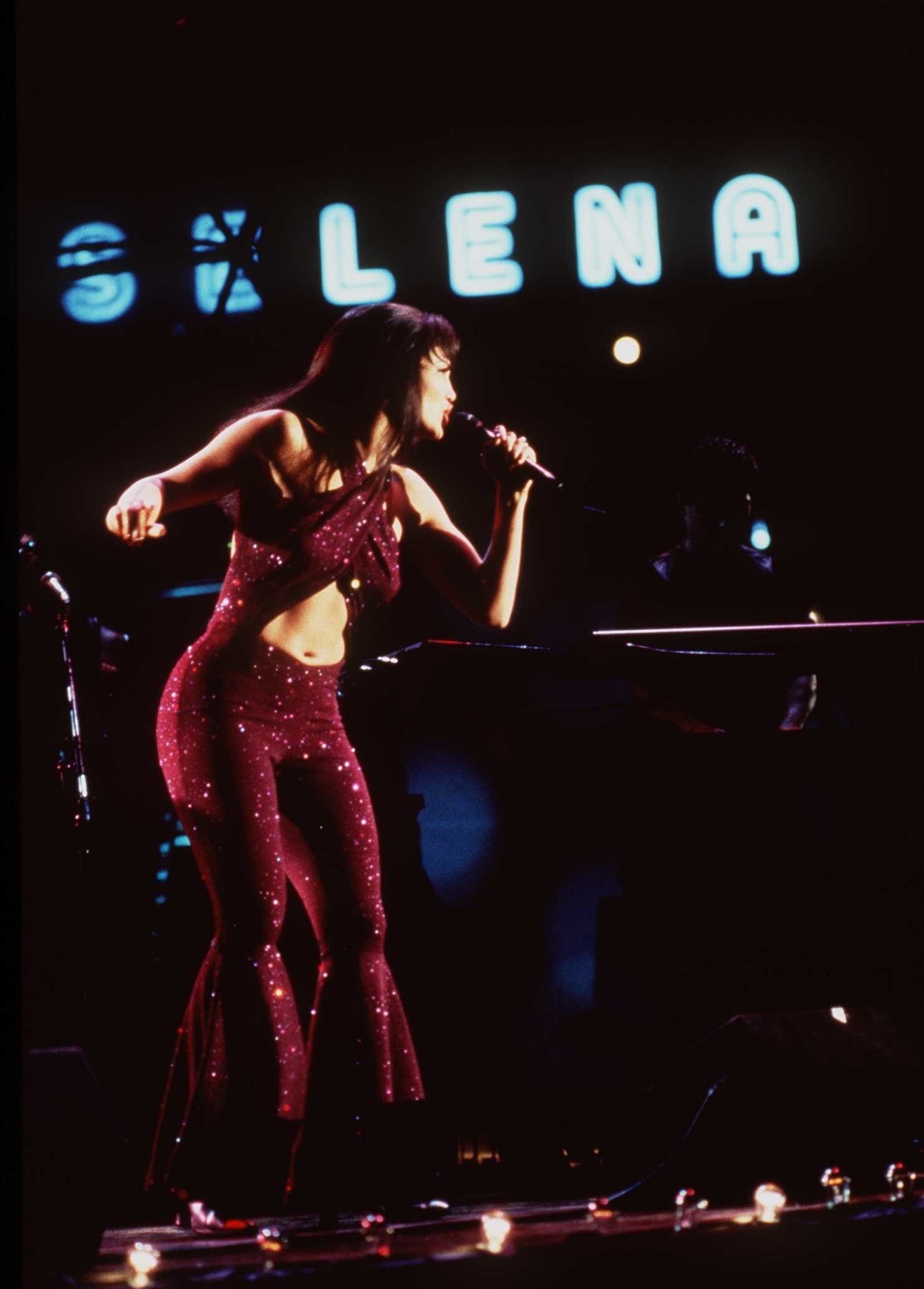Selena performing in a jumpsuit