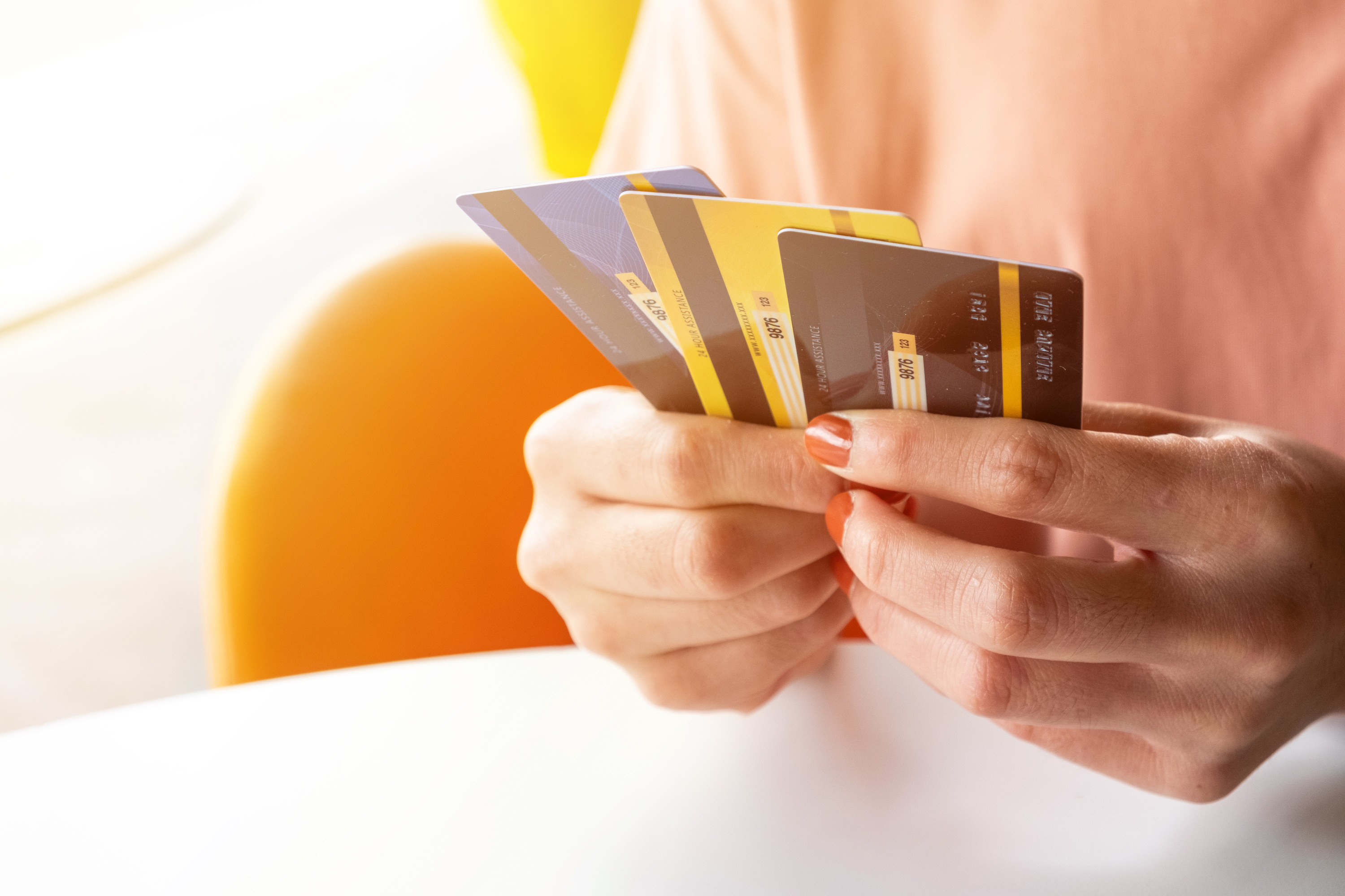 Person holding credit cards