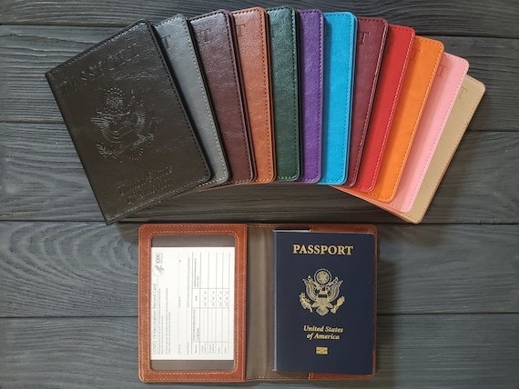 black, blue, red, and white passport cases