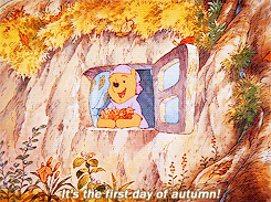 Gif of Winnie the Pooh throwing leaves joyfully from a window saying &quot;it&#x27;s the first day of autumn&quot;