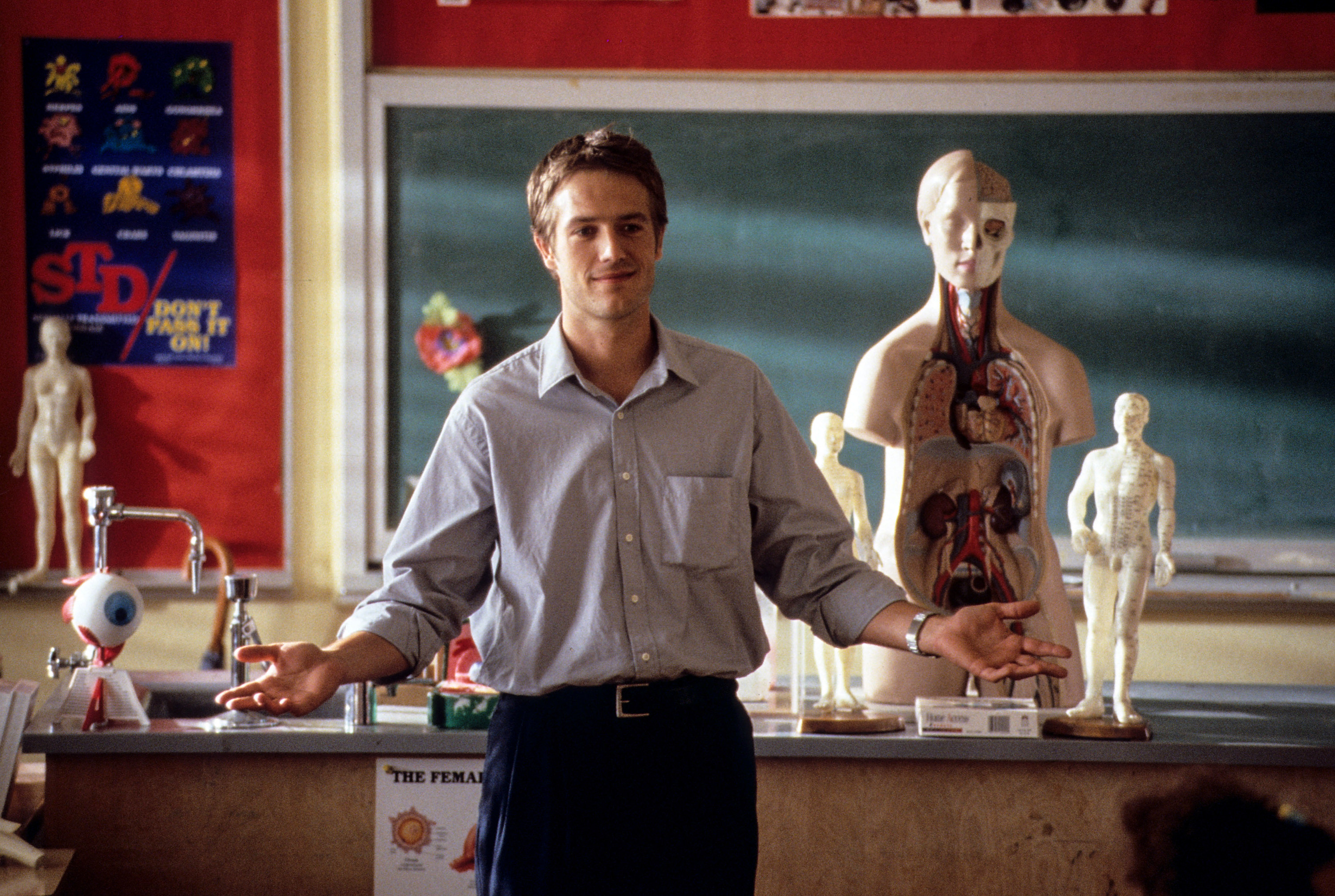 Michael&#x27;s character stands in front of a classroom while teaching