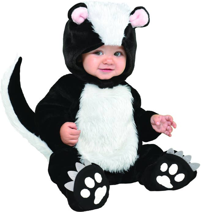 baby in black and white skunk costume