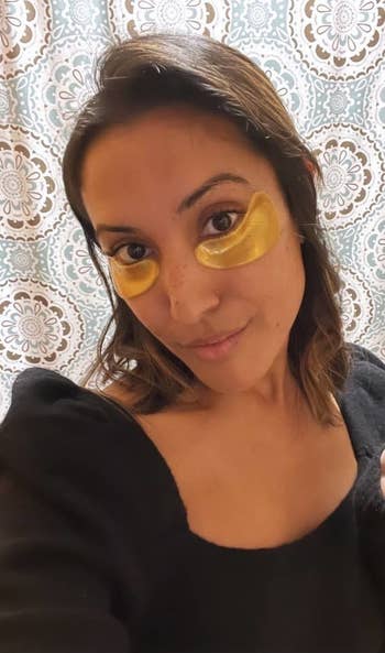 BuzzFeed associate editor Jasmin Sandal with wears gold under eye masks