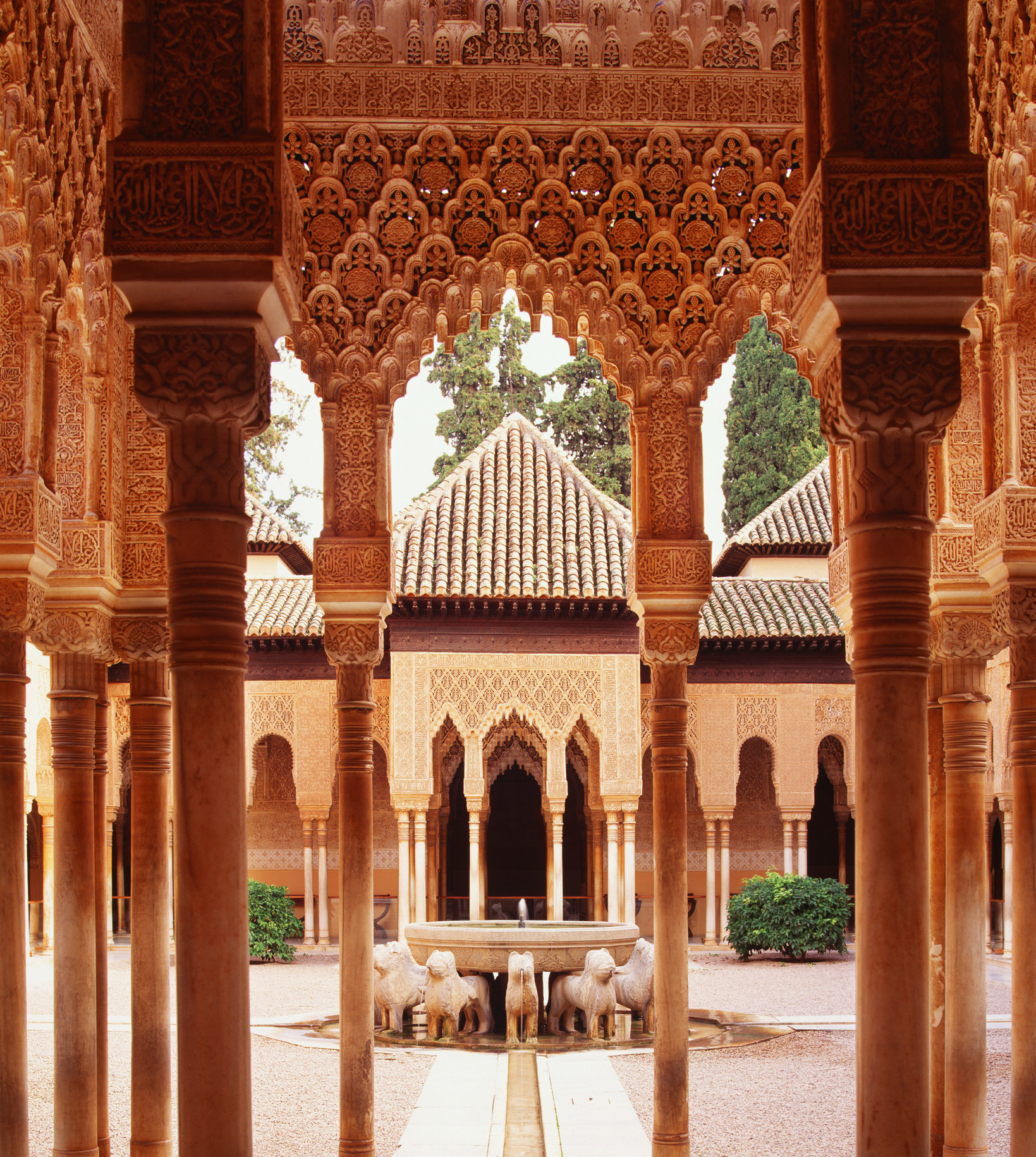 A courtyard framed with carvings in the Alhambra.