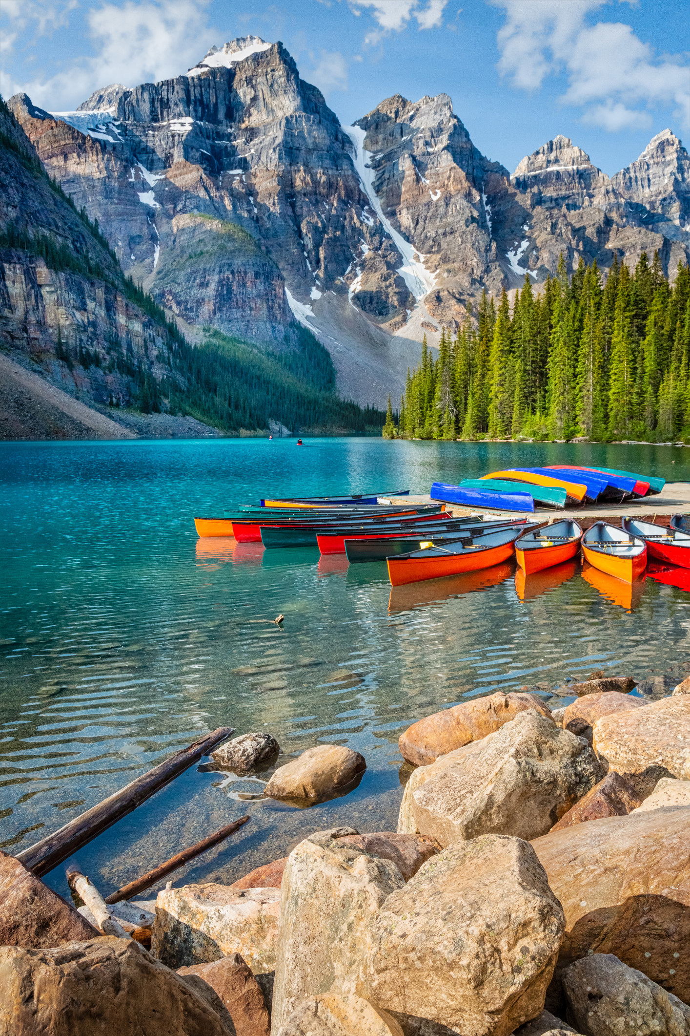 Moraine Lake with Colorful Canoes Banff National Park Canada.
