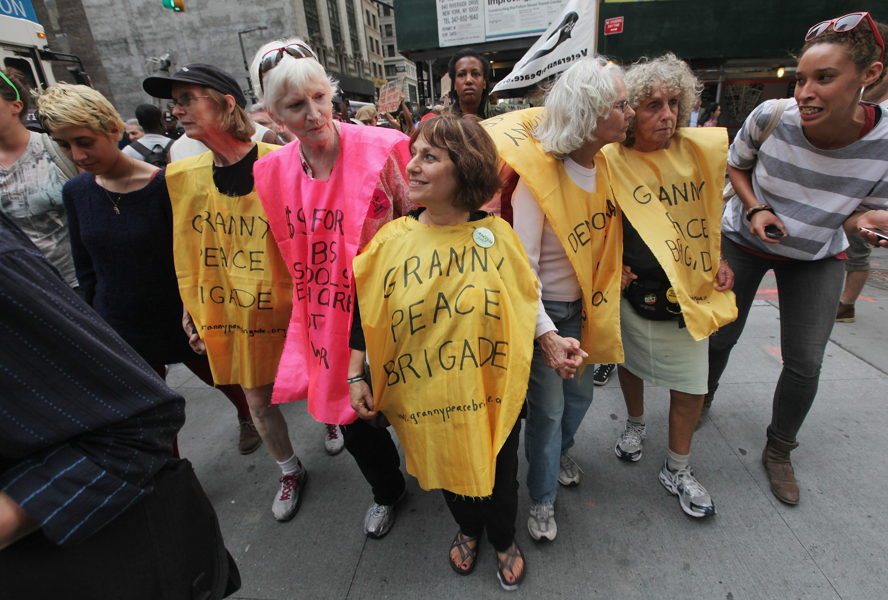 A group of women wearing outfits that read &quot;Granny Peace Brigade&quot; take part in Occupy Wall Street