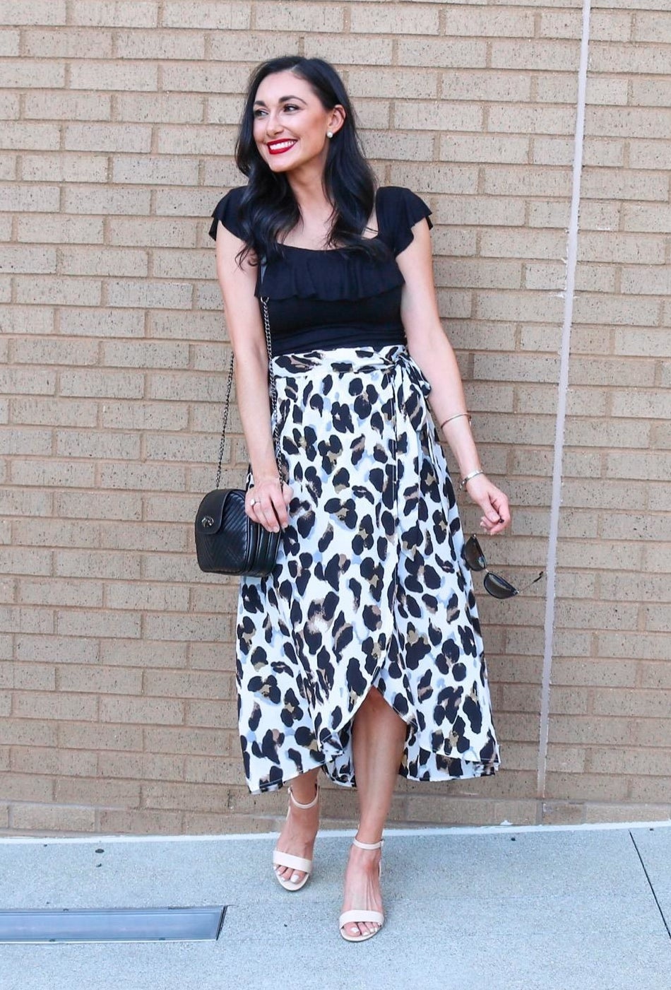 Reviewer wearing white leopard print wrap skirt