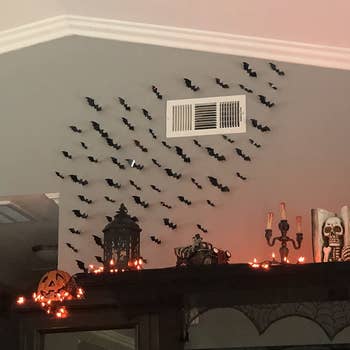 reviewer's bats going up their wall, above an entertainment center 