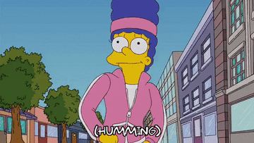 Marge Simpson power walking on the sidewalk