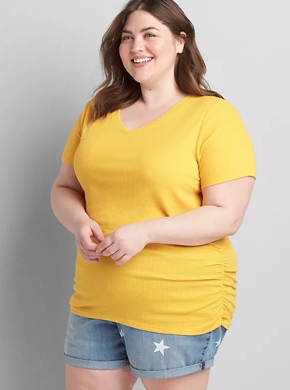 Model wearing yellow shirt with jeans
