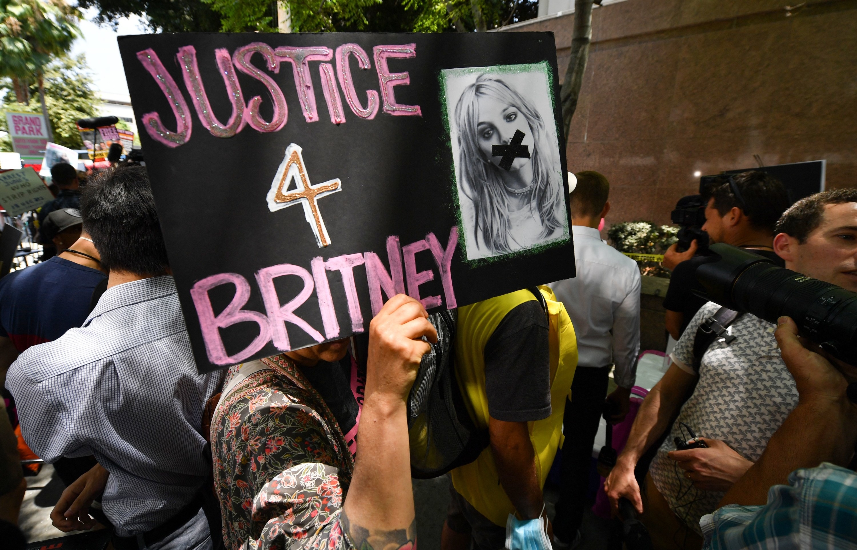 A person holding a &#x27;Justice 4 Britney&#x27; sign