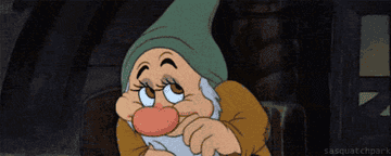 a gif of bashful from snow white being bashful