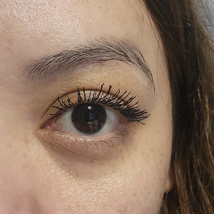 same reviewer's eye with mascara, showing lashes looking fuller and longer