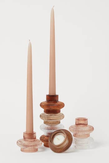 a stack of tealight and tapered candle holders