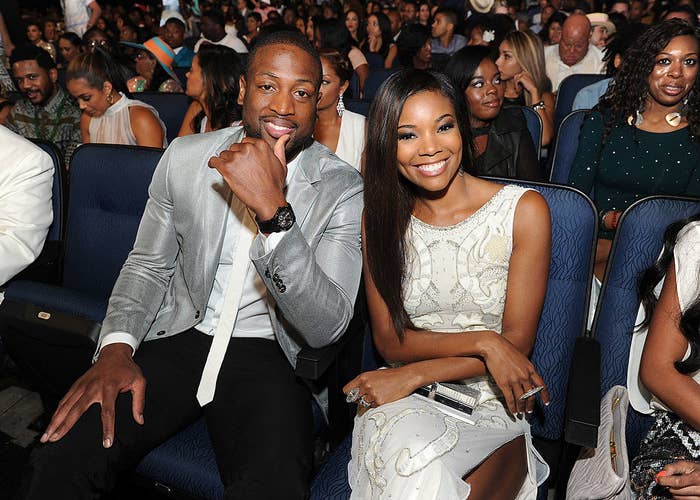The couple sitting front row at an event