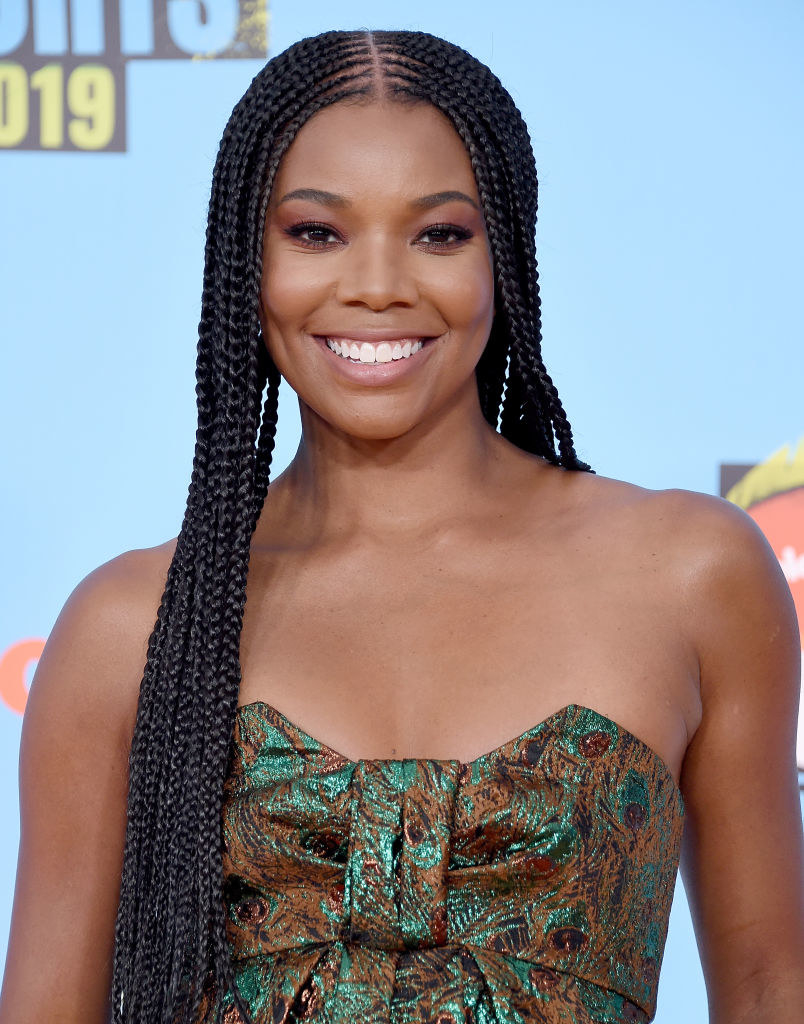Gabrielle wearing a textured strapless outfit at an event