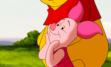 a gif of piglet looking at something lovingly