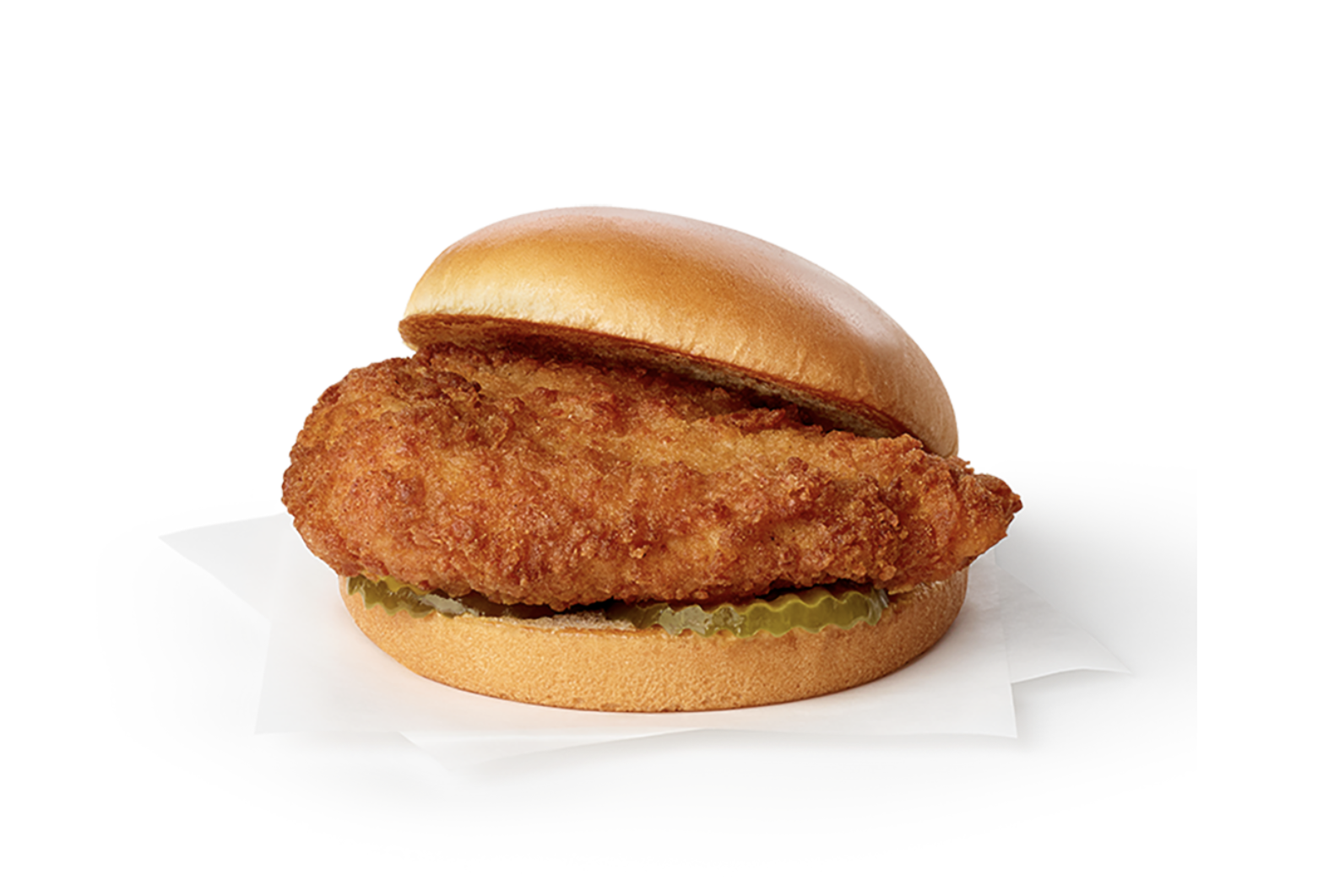 A chicken sandwich with pickles