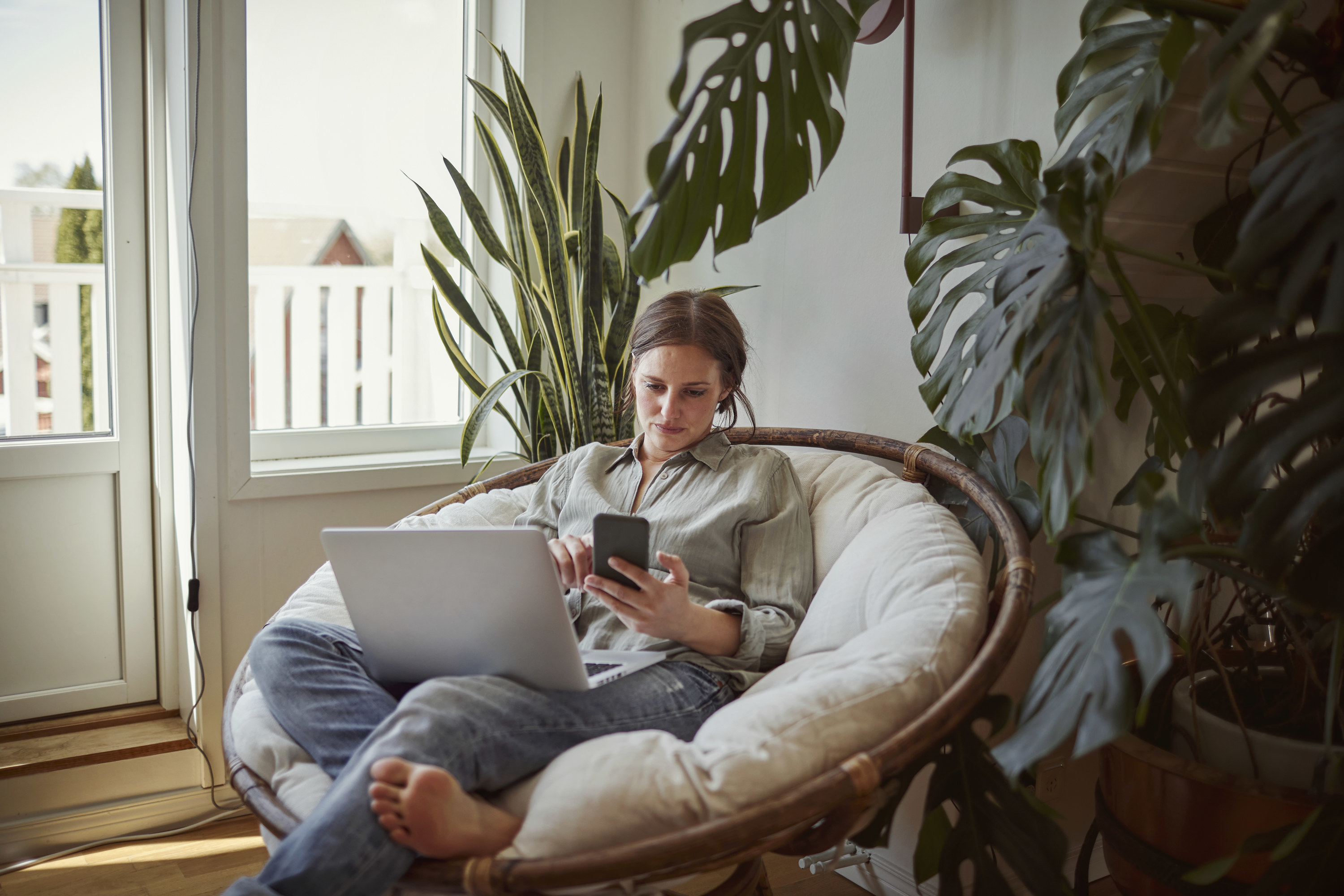 Photo of a person sitting in a white Papasan chair