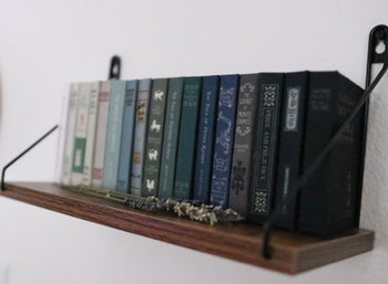 Shelf of book wallets on a wall