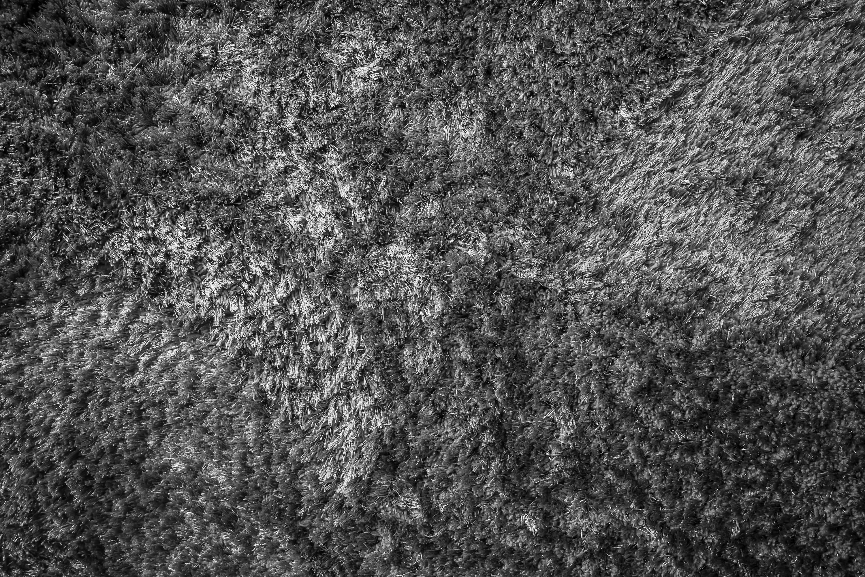 Close up photo of a grey textured rug