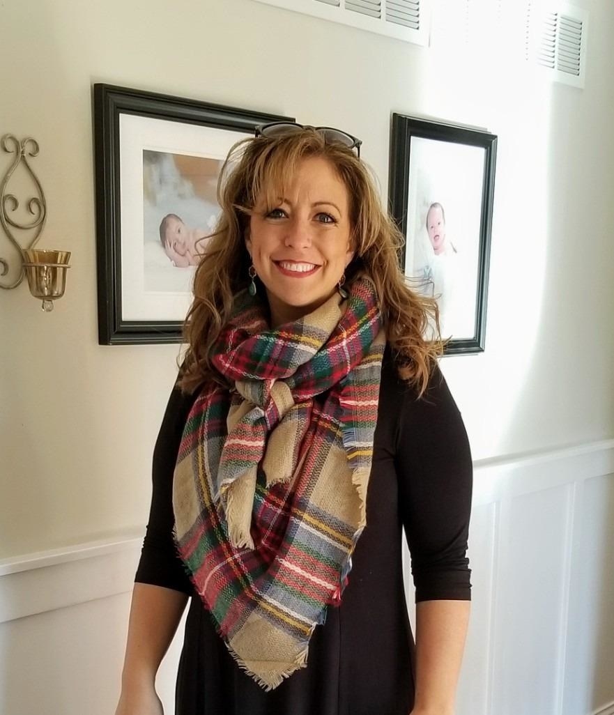 Reviewer wearing plaid scarf