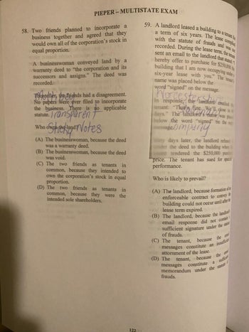 Reviewer showing book with sticky note taped on page