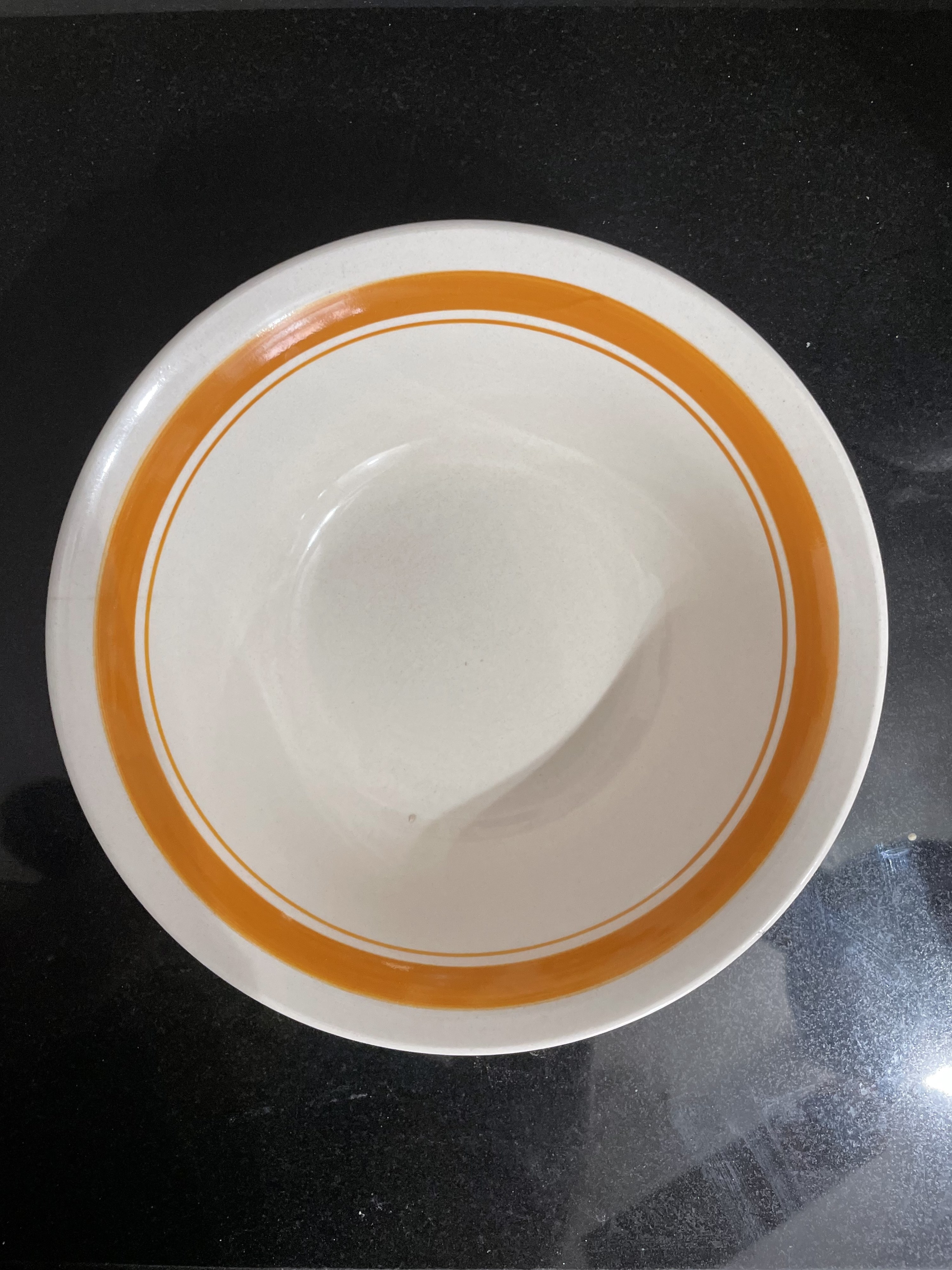 A Ceramic bowls with the colored ring inside