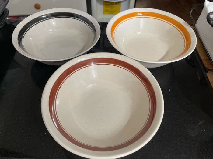 Ceramic bowls with colored rings inside of them