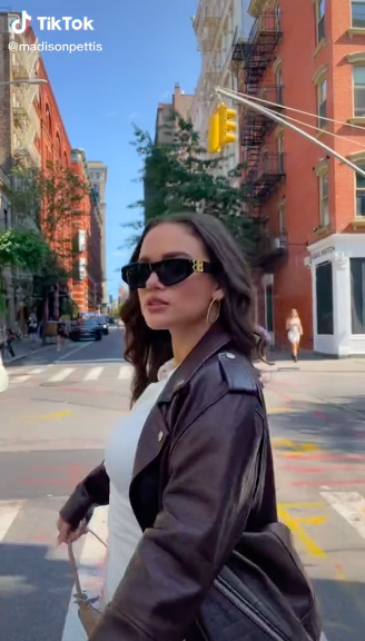 Madison walking in heels and leather jacket in NYC