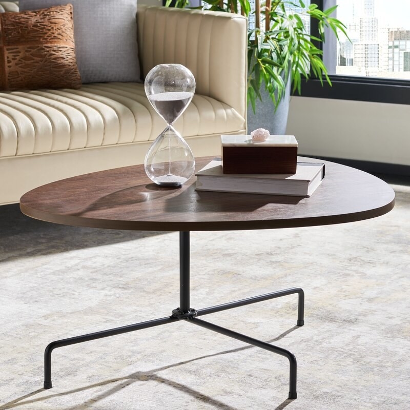 The walnut black tripod pedestal coffee table