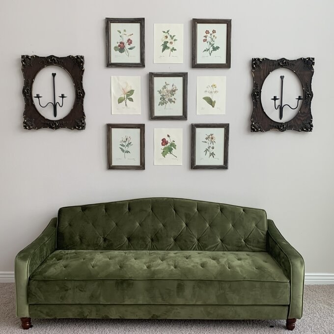 the green velvet sofa with plant artwork above it